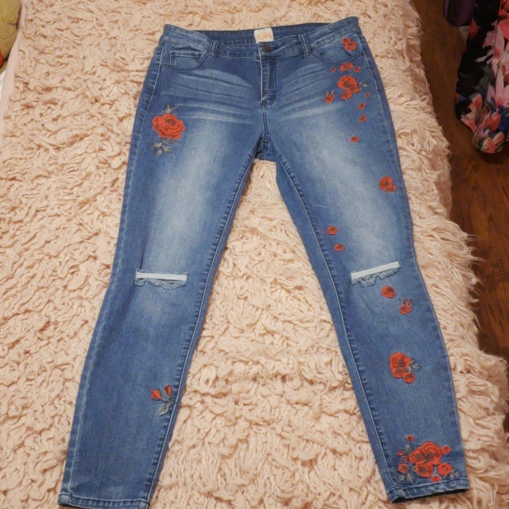Medium wash jeans with embroidered red roses